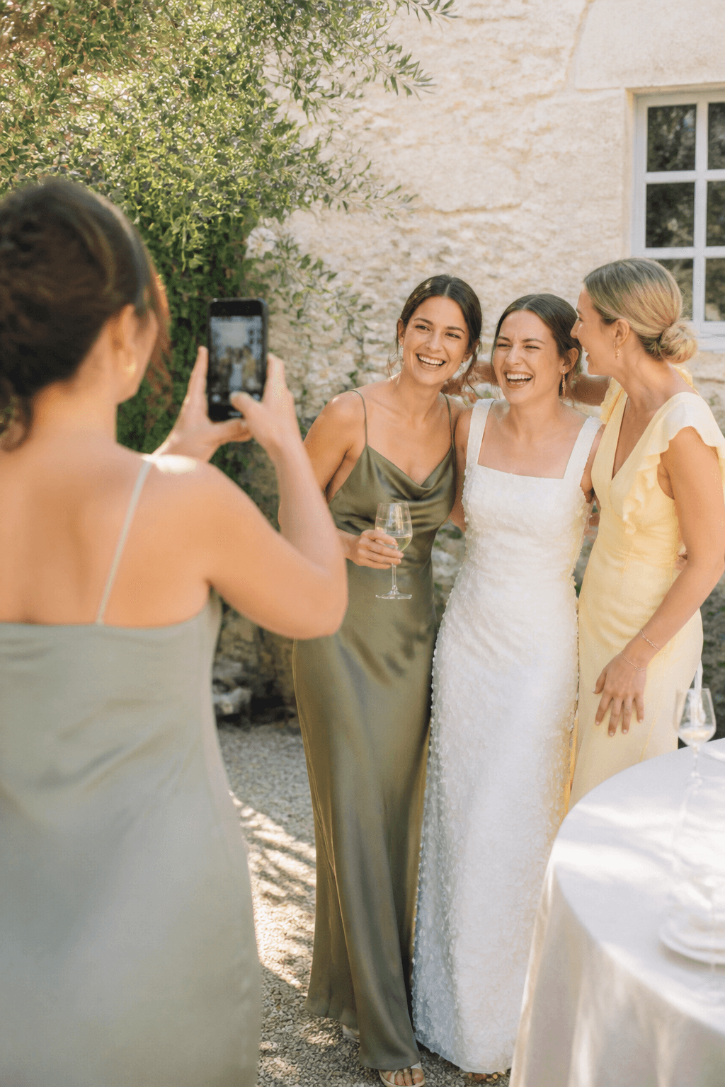 Wedding guest photographing friends on a phone